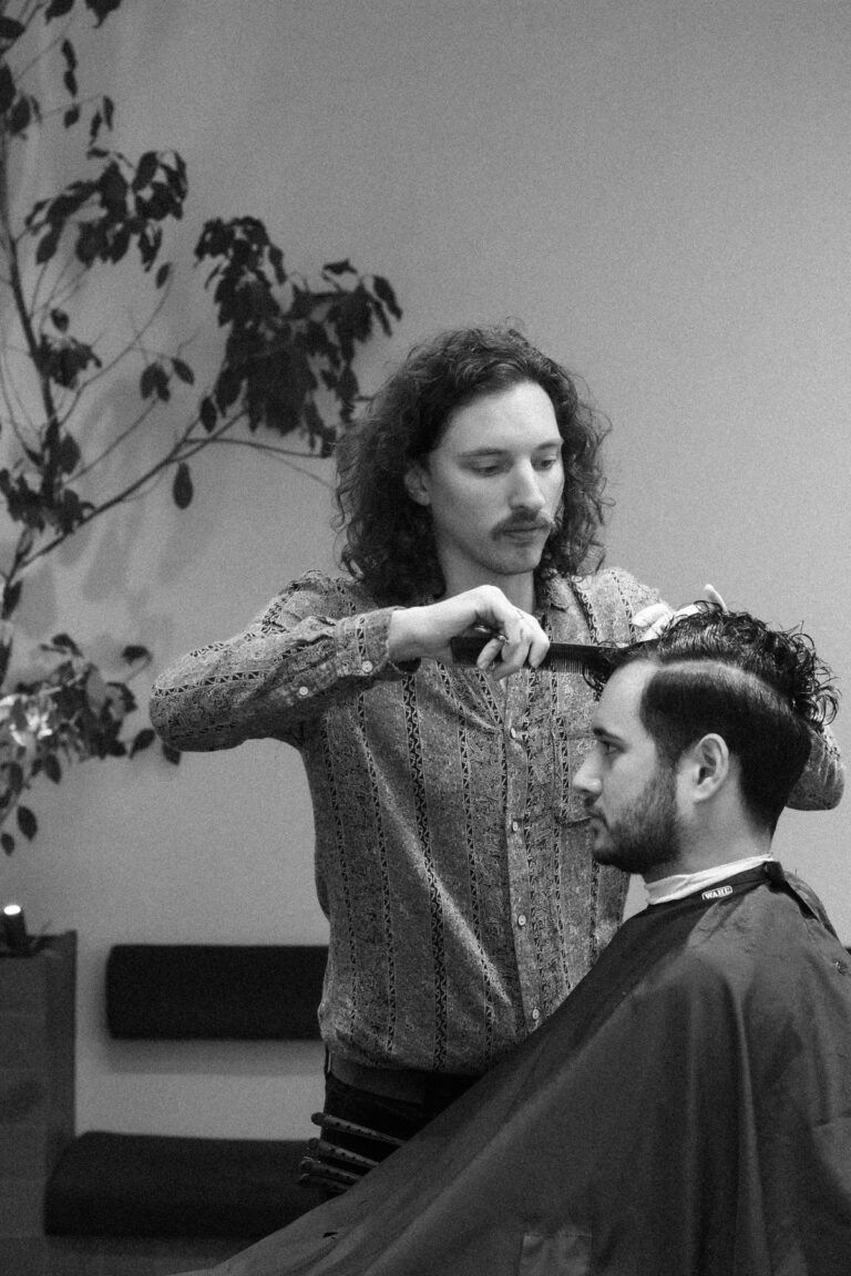 Zack, Master Stylist cutting hair at Stravinskij barbers.